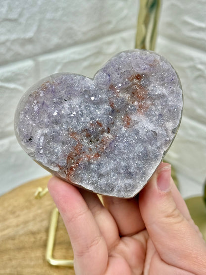 Beautiful lavender amethyst heart with hematite on gold stand from Brazil