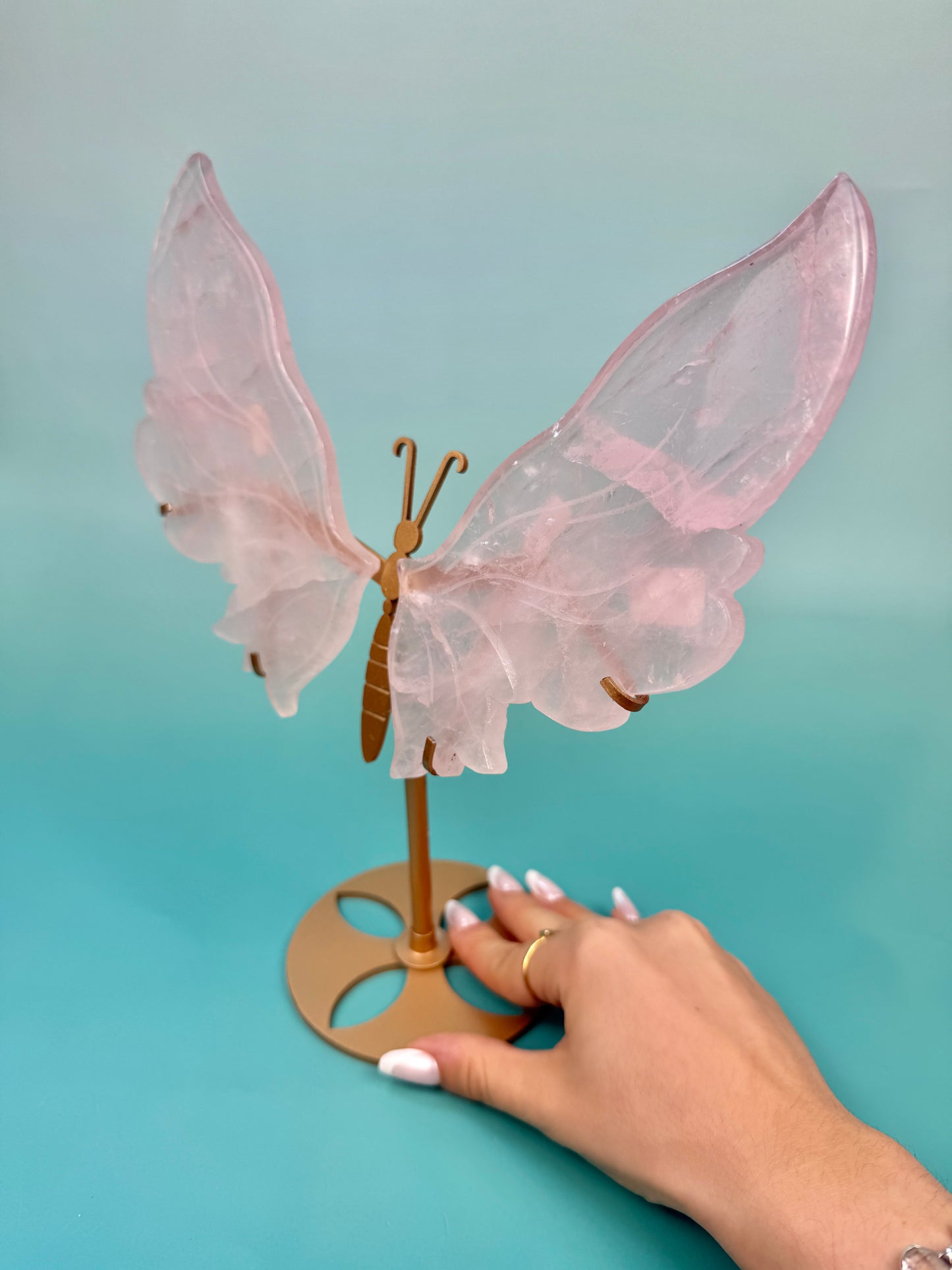 Beautiful rose quartz butterfly on gold stand