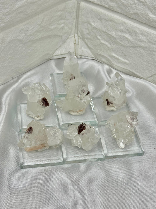 1 diamond apophyllite on stand with red stillbite from India