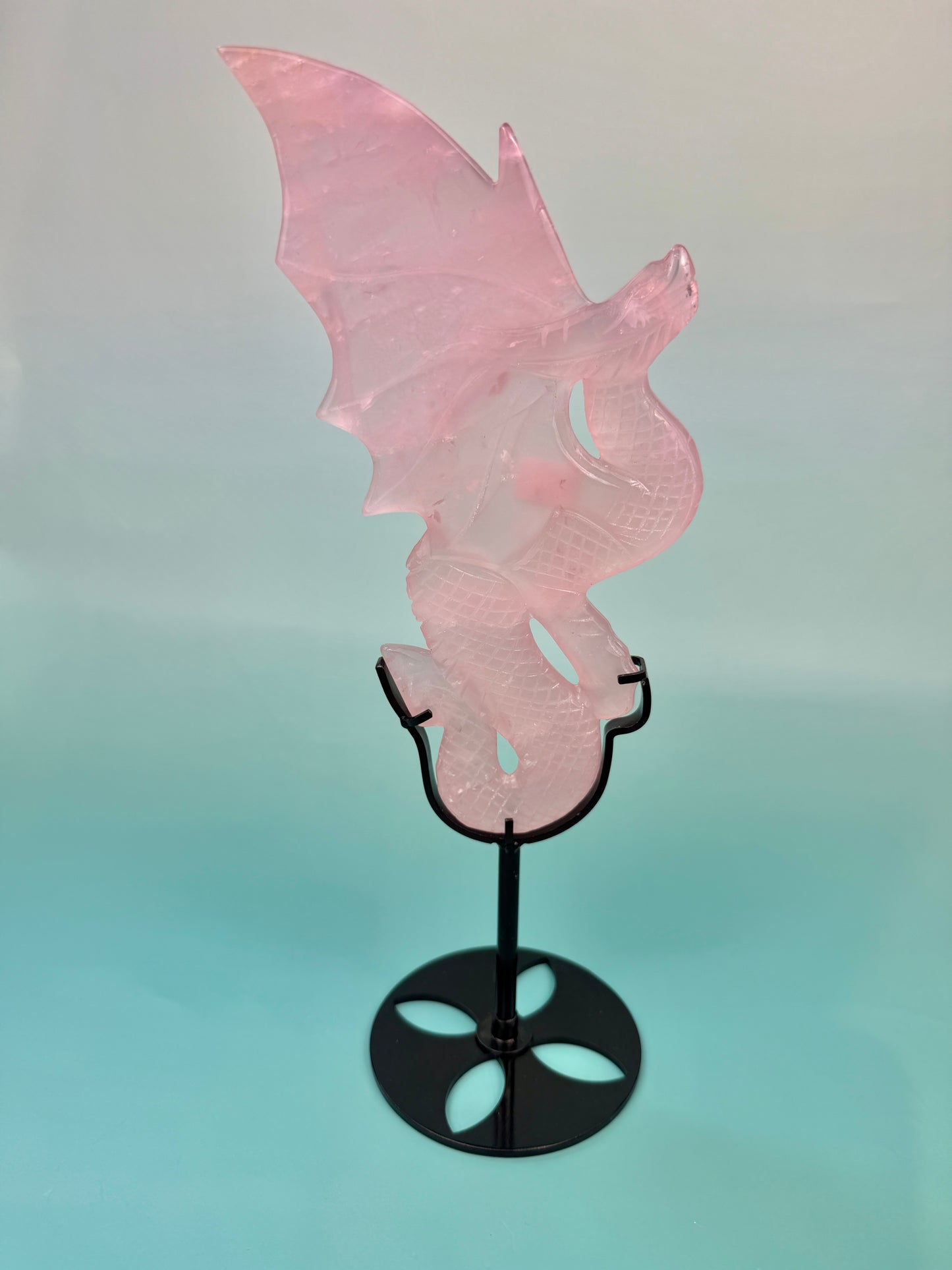Stunning rose quartz dragon on black stand