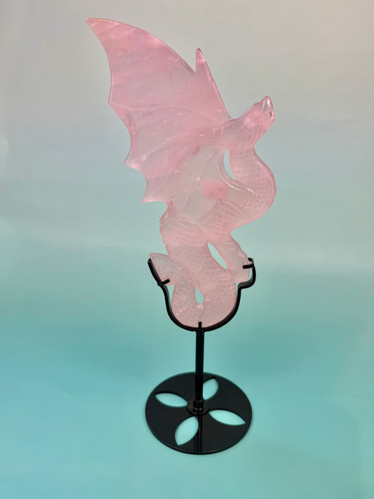 Stunning rose quartz dragon on black stand