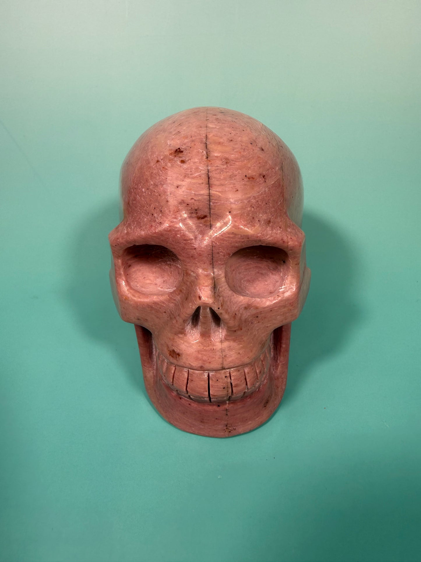 Amazing deep pink rhodonite skull