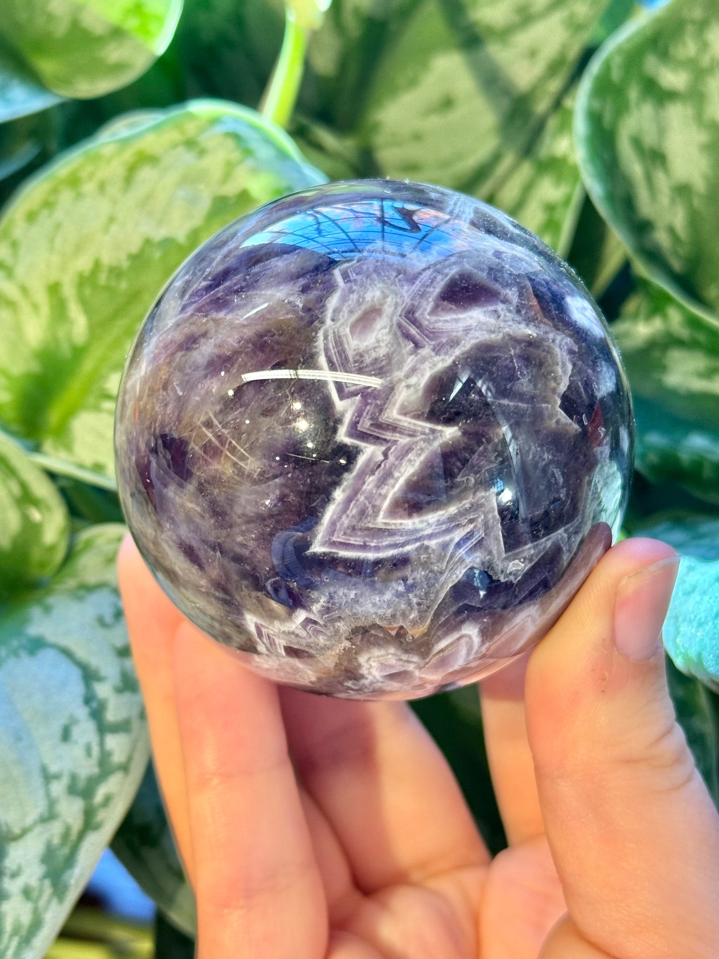 Stunning chevron amethyst sphere