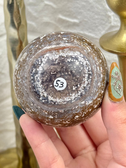 Purple/brown sea jasper sphere
