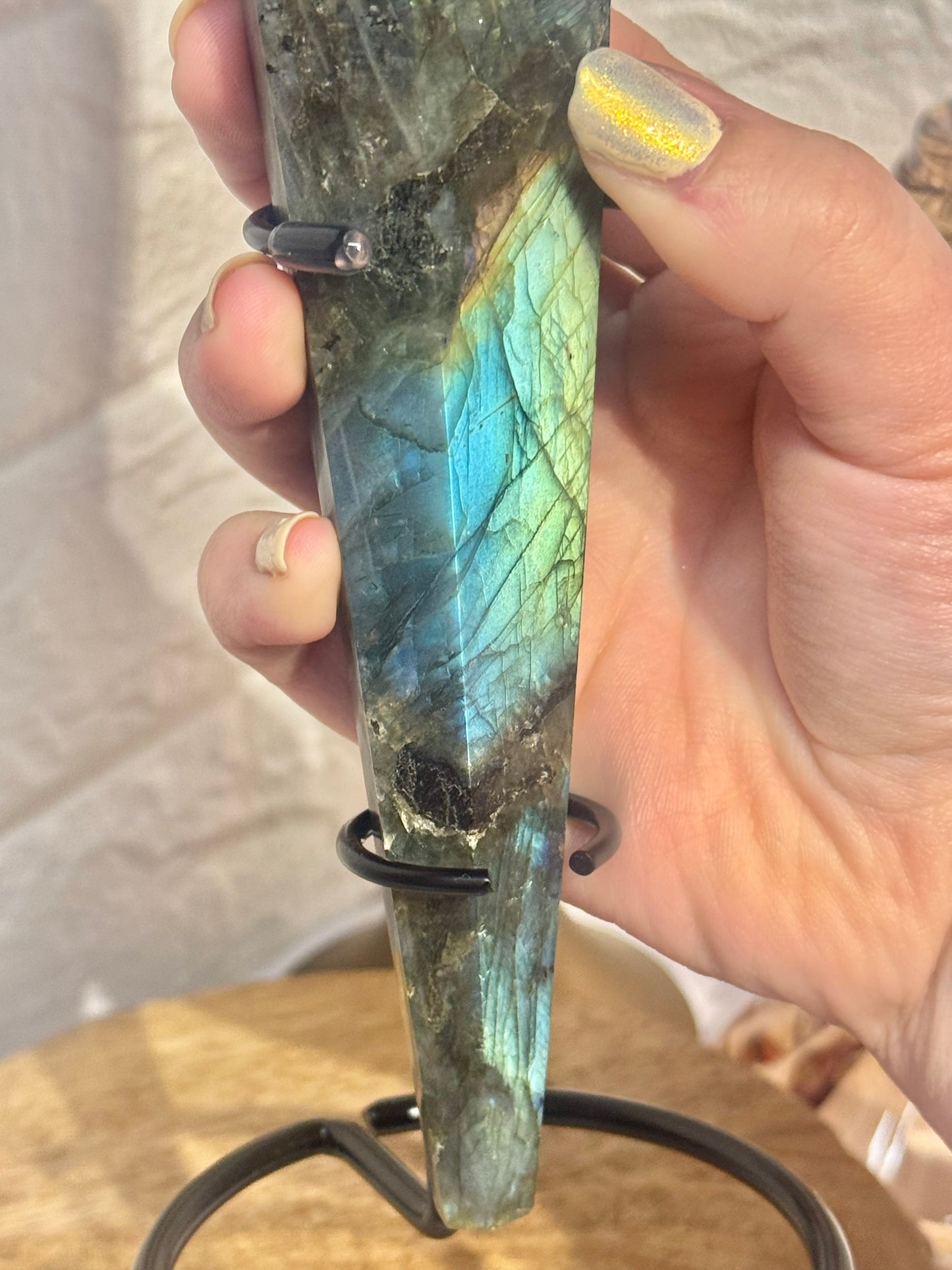 Flashy labradorite wand on custom black stand