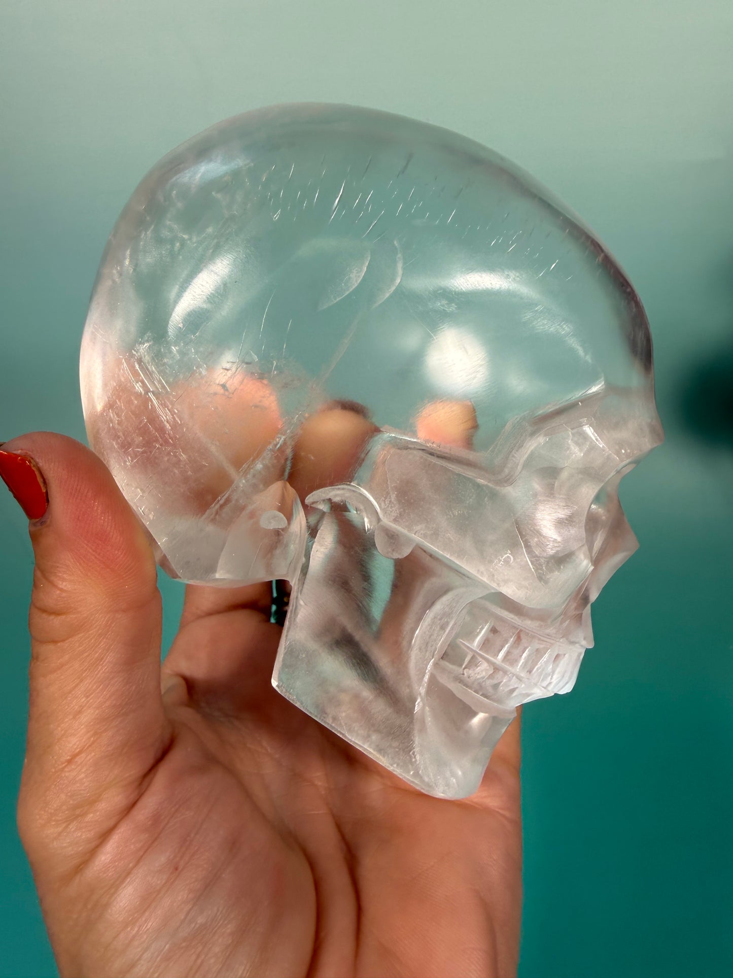 Beautiful satin spar skull carving Q