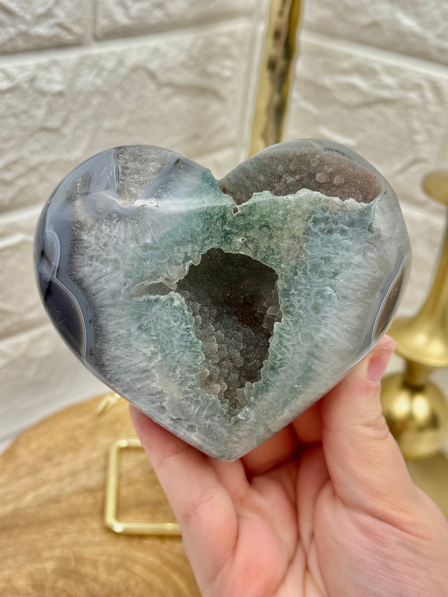 Sugary green amethyst heart on gold stand from Brazil