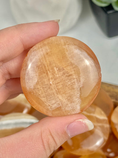 1 honey calcite “cookie” flat stone