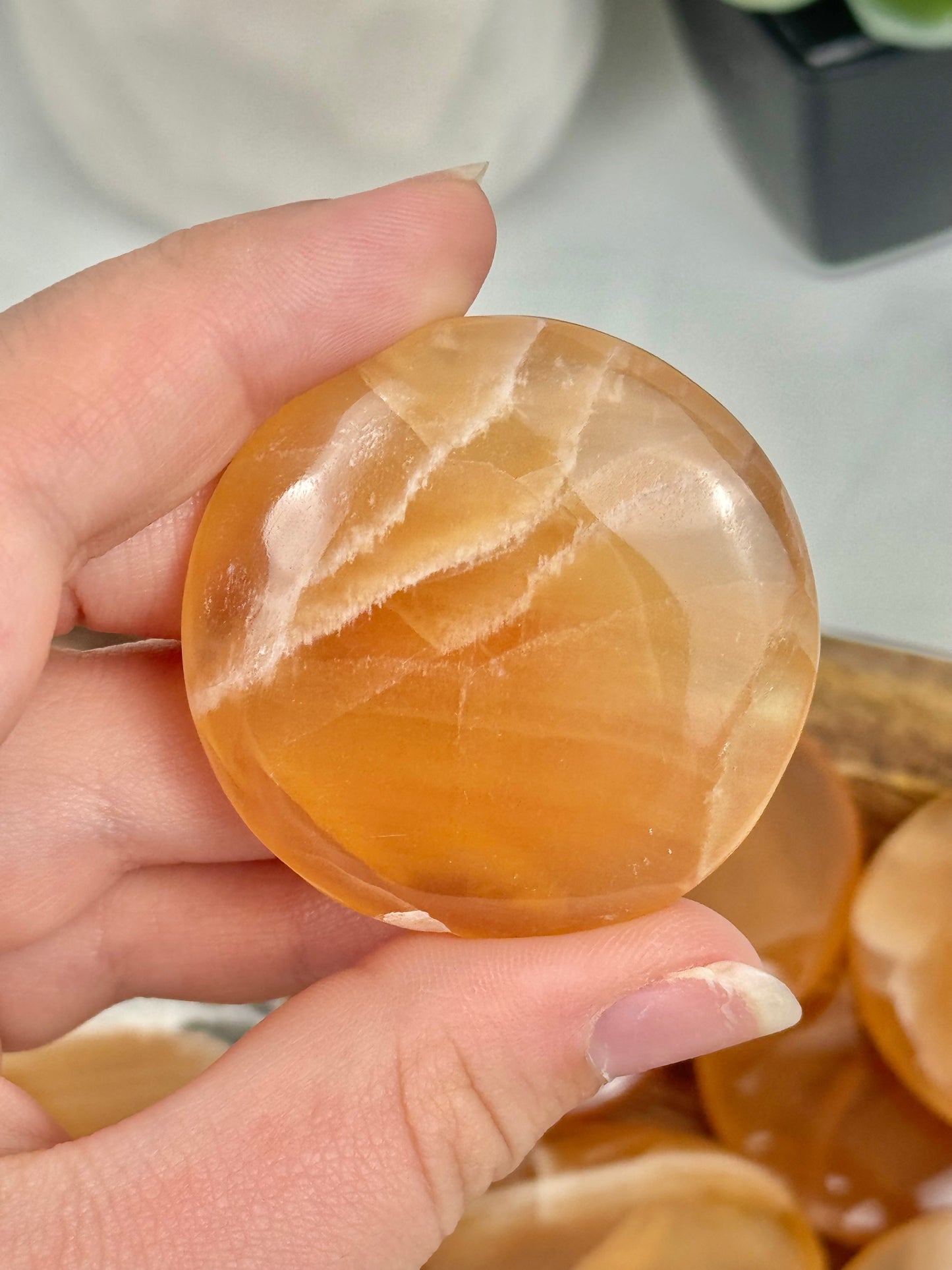 1 honey calcite “cookie” flat stone