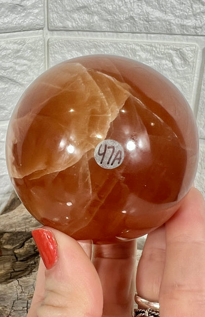 Juicy honey calcite sphere A