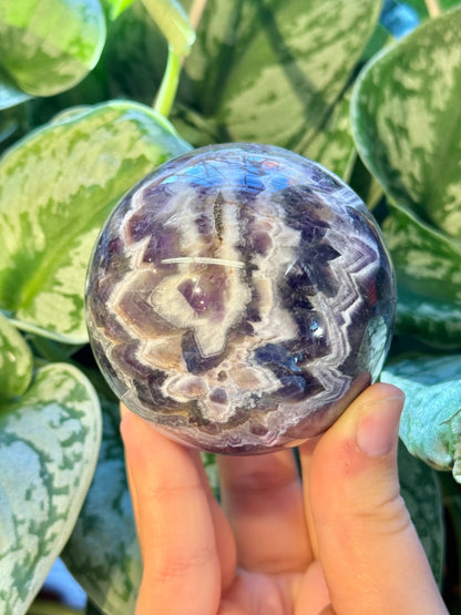 Stunning chevron amethyst sphere