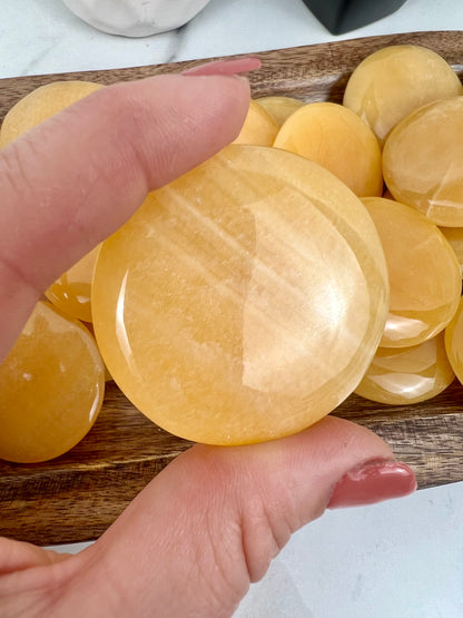 1 Orange calcite “cookie” flat stone