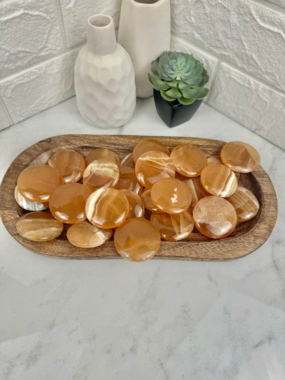 1 honey calcite “cookie” flat stone