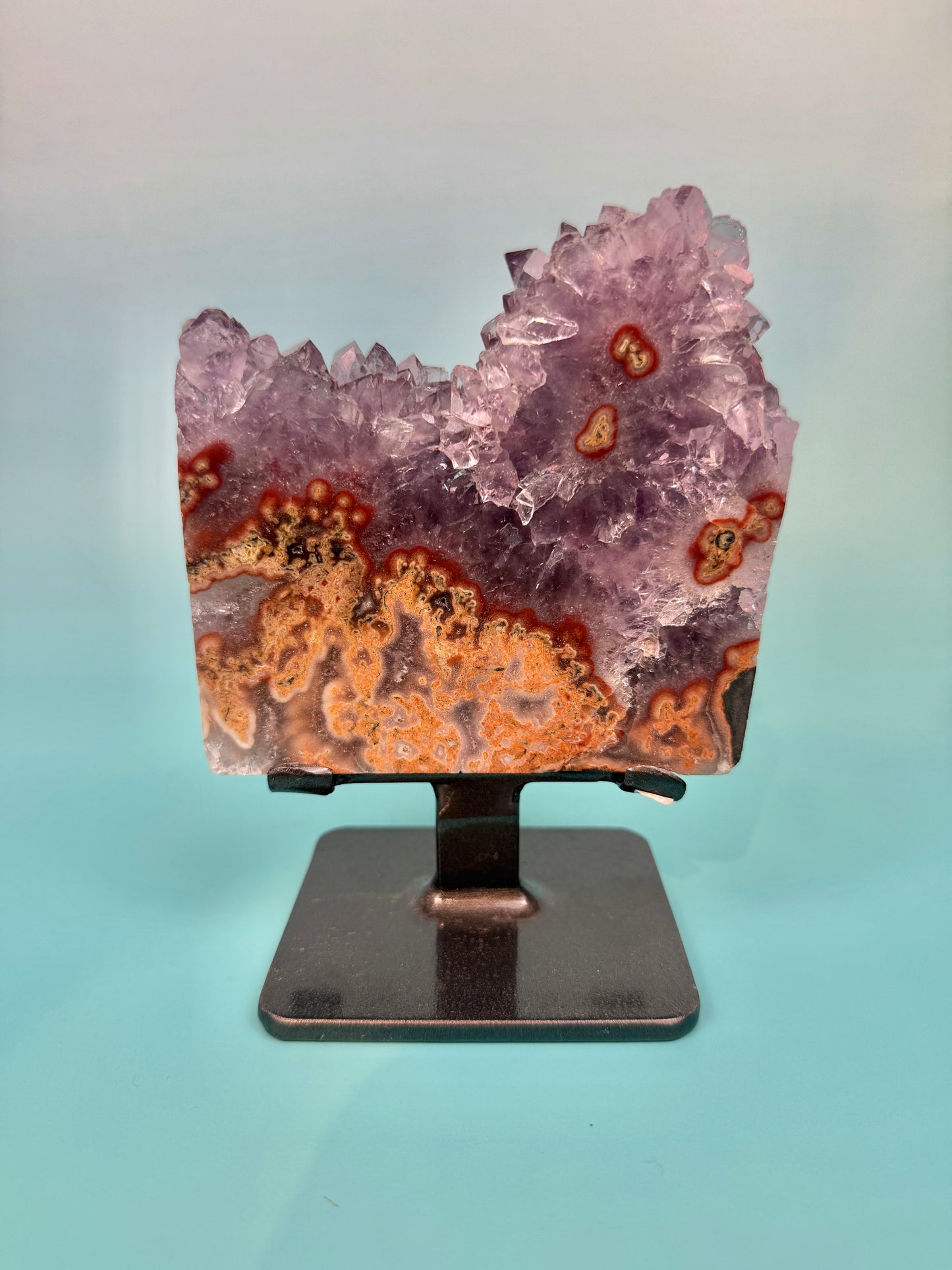 Stunning purple amethyst stalactite slab with peach jasper on stand from Uruguay