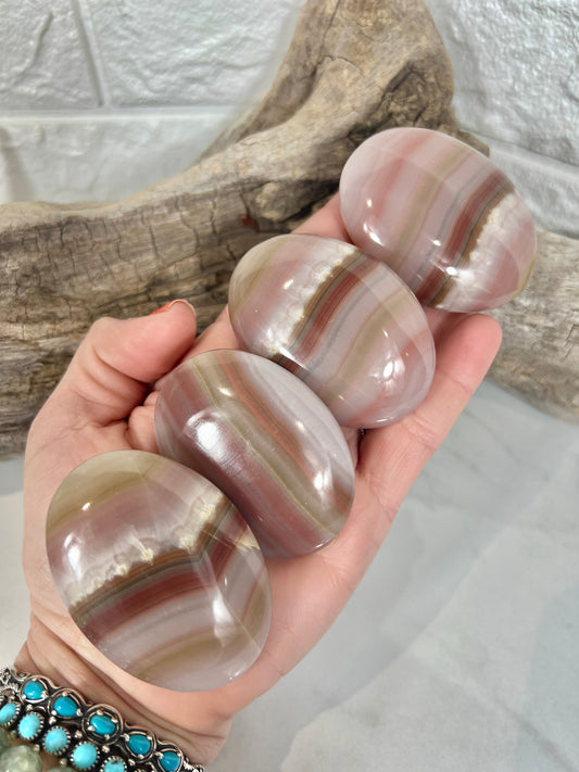 1 pink banded calcite palm stone