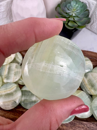 1 pistachio calcite “cookie” flat stone