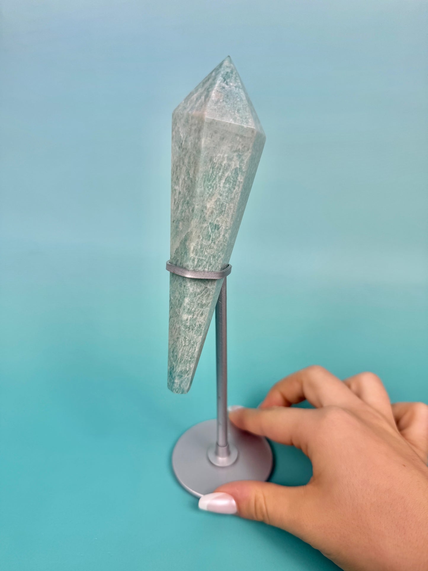 Amazonite point on silver stand