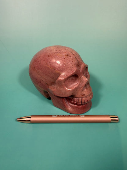 Amazing deep pink rhodonite skull
