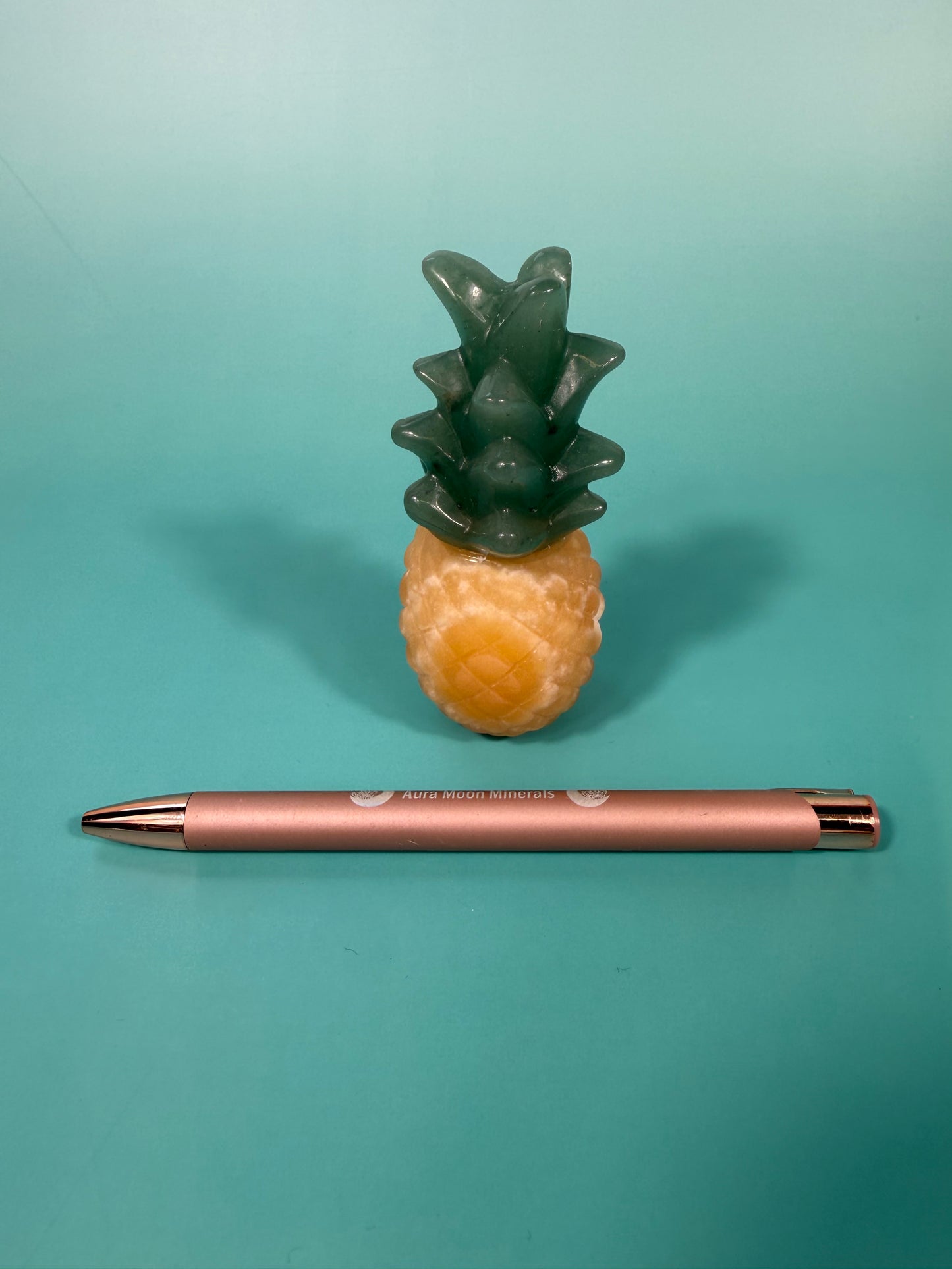1 Orange calcite, green aventurine pineapple carving