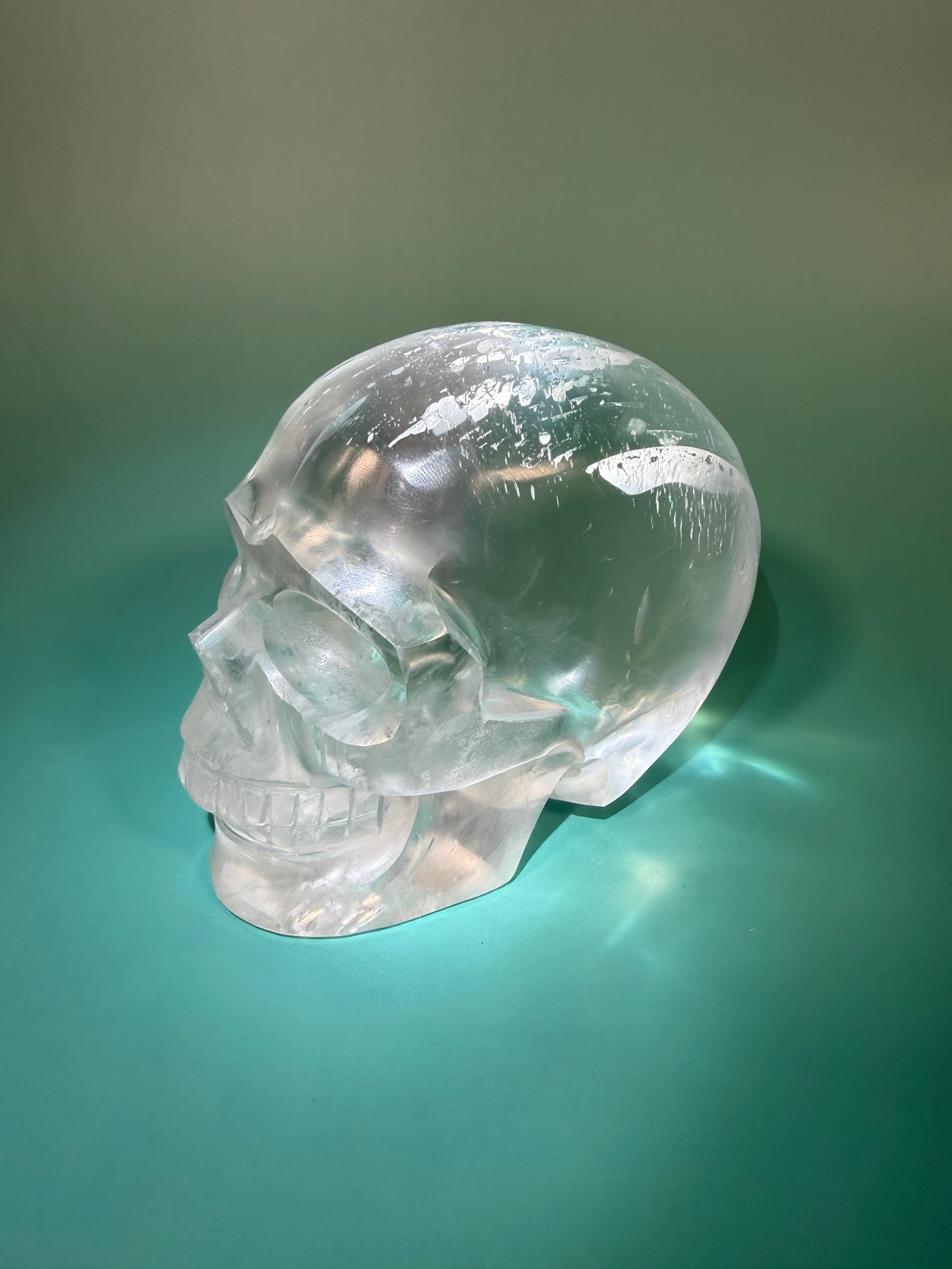 Beautiful satin spar skull carving Q