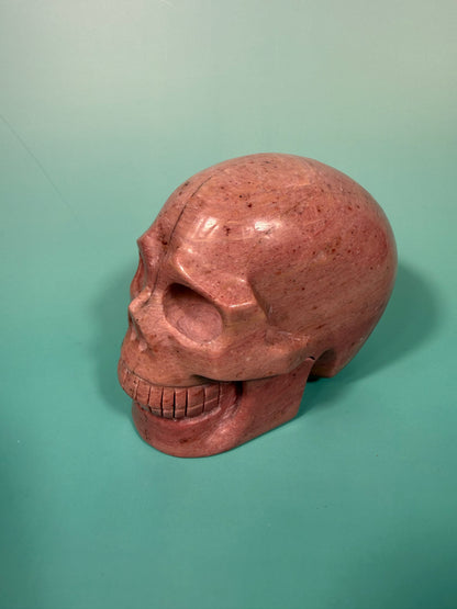 Amazing deep pink rhodonite skull