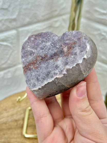 Beautiful lavender amethyst heart with hematite on gold stand from Brazil