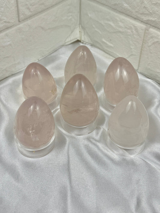 1 gemmy rainbow filled rose quartz egg from Madagascar