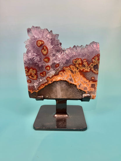 Stunning purple amethyst stalactite slab with peach jasper on stand from Uruguay