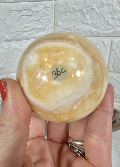 Stunning orange calcite sphere C