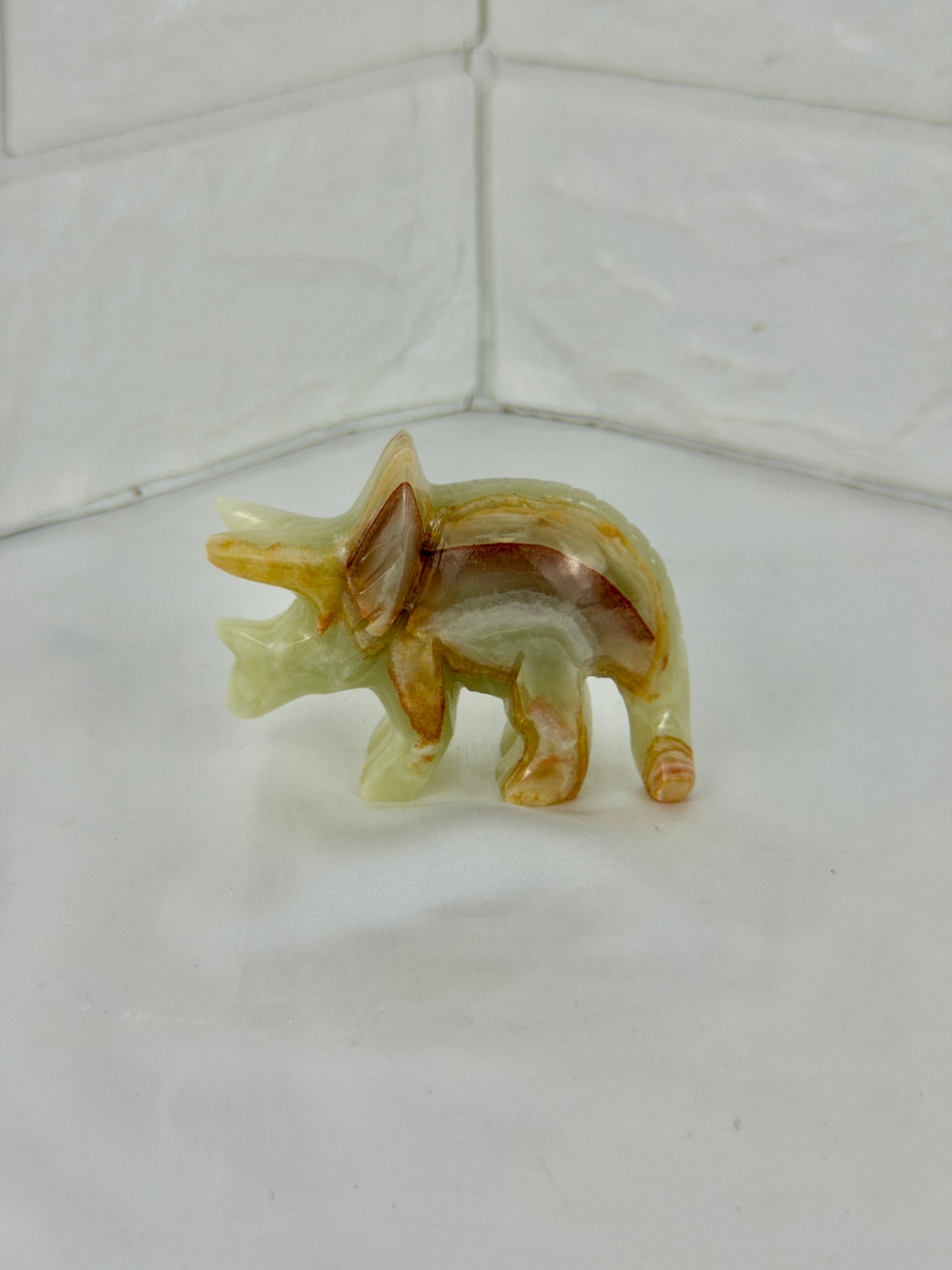1 green calcite triceratops carving