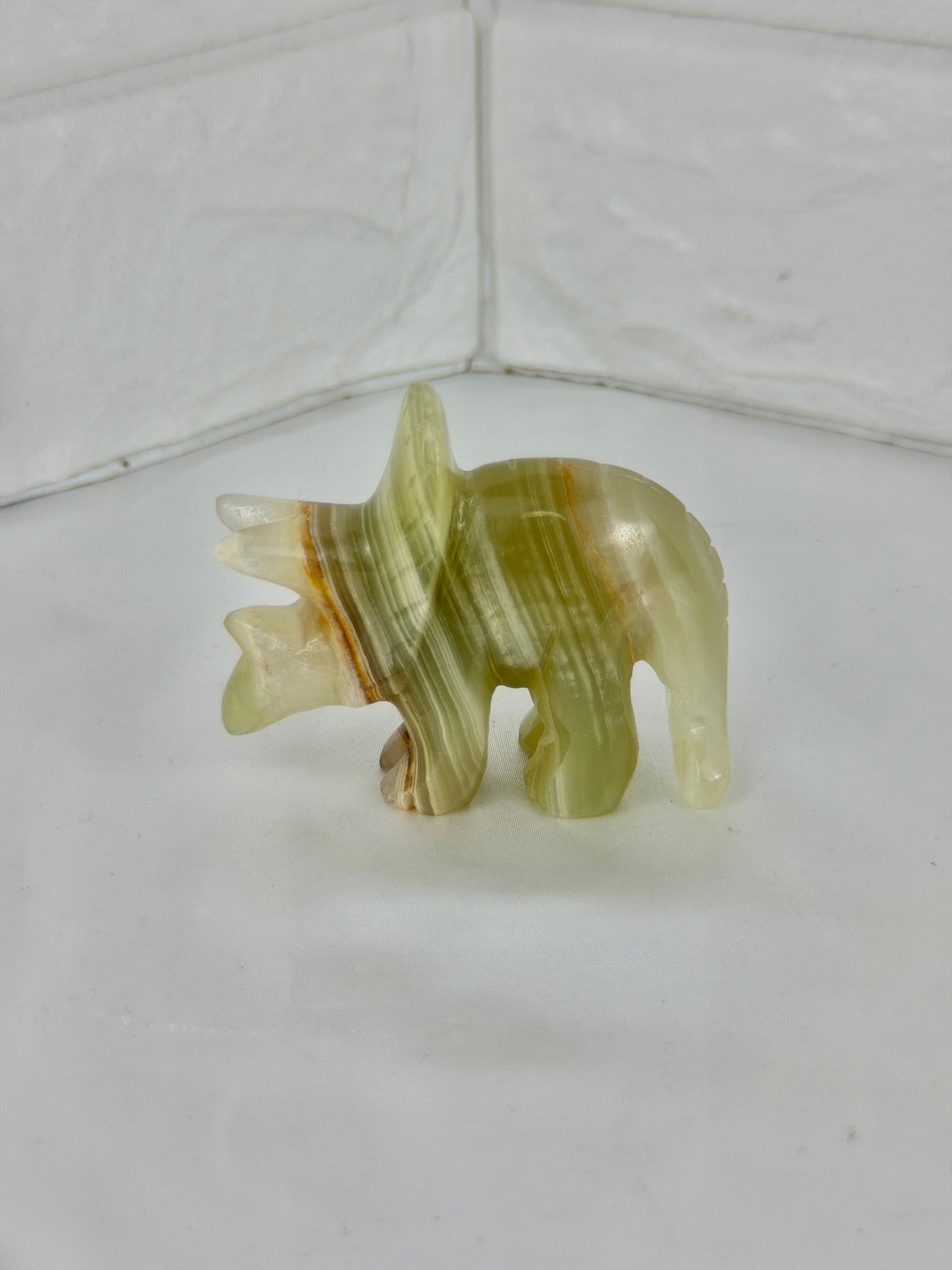 1 green calcite triceratops carving