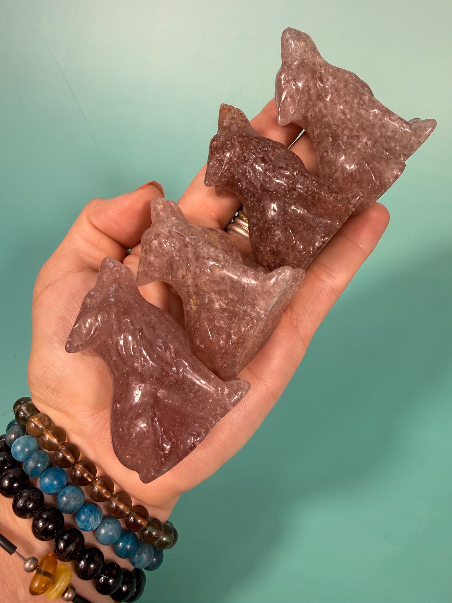 1 strawberry quartz wolf carving
